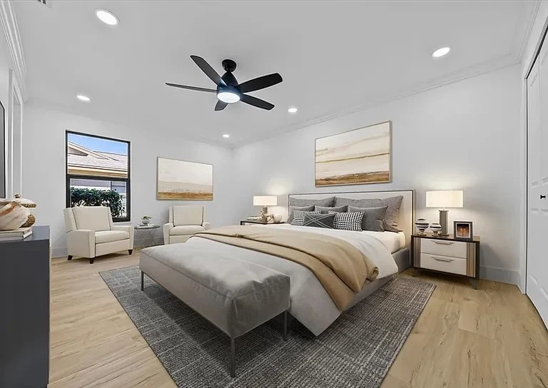 Style SPC Lite light oak luxury vinyl plank in a furnished master bedroom