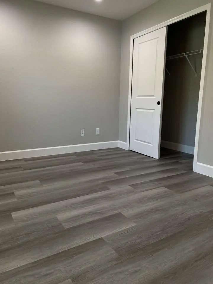 Greige wide-plank luxury vinyl flooring
