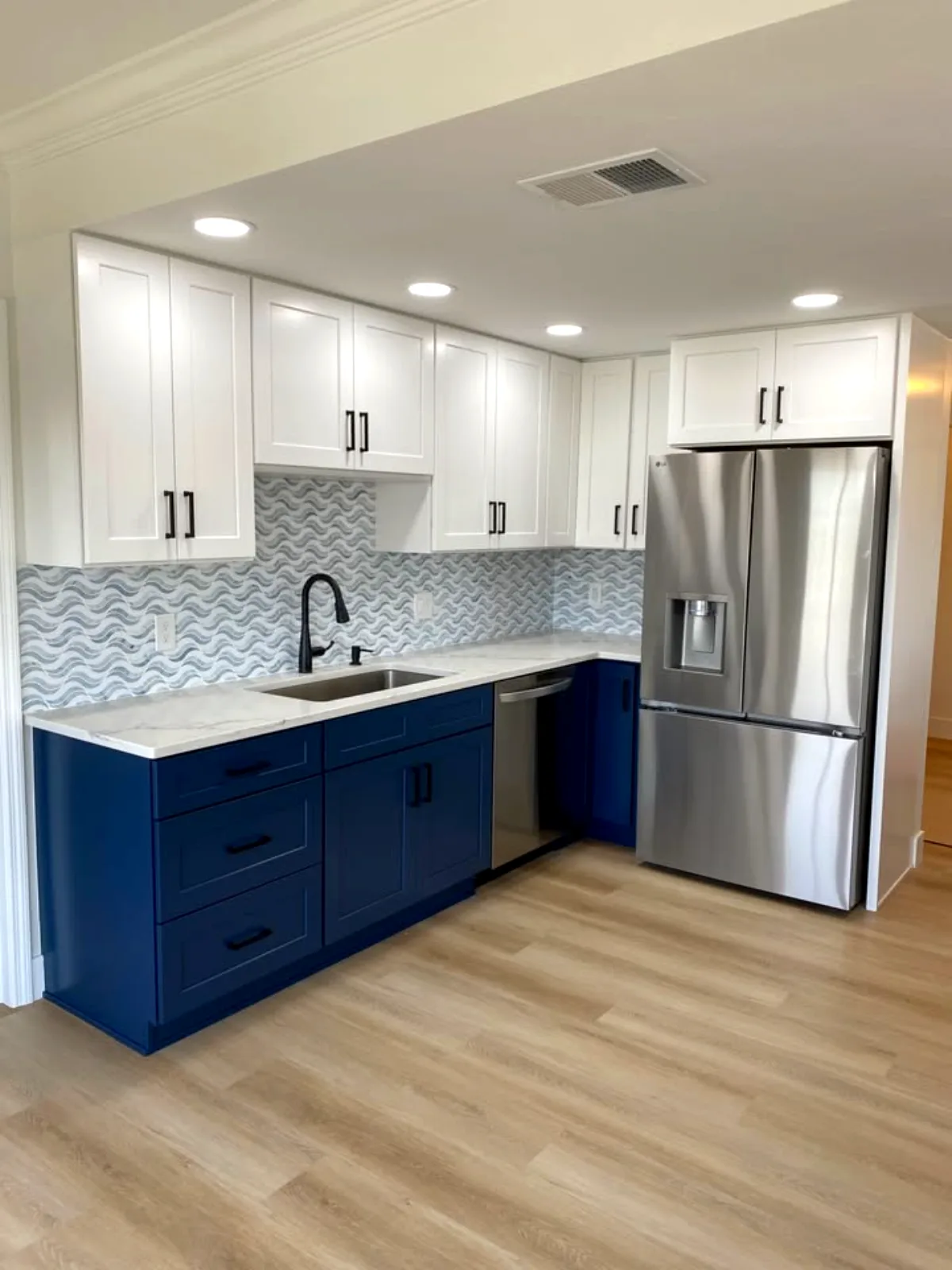 Remodeled navy and white kitchen in Fort Myers