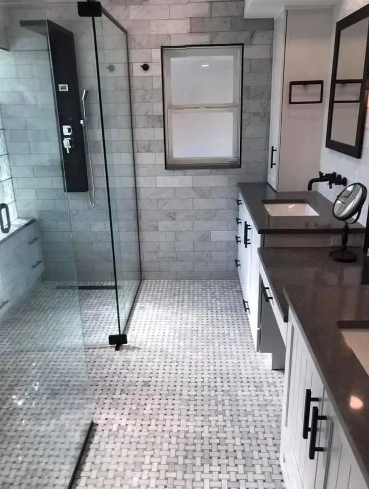 Master bathroom walk-in shower with mosaic floor and double vanity