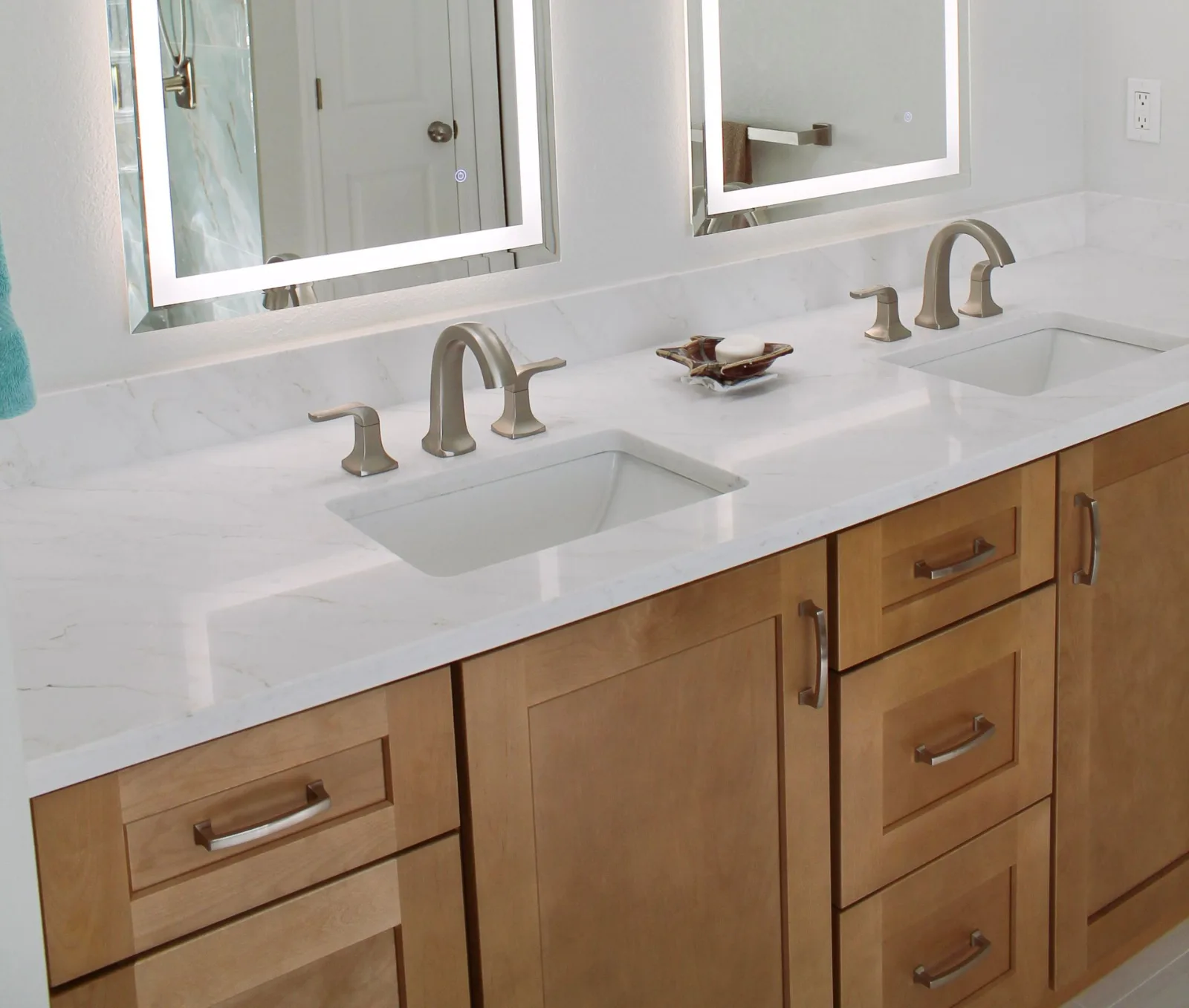 Honey oak double vanity with quartz top, LED mirrors and brushed nickel faucets — Blue Luxe bathroom remodel, Fort Myers