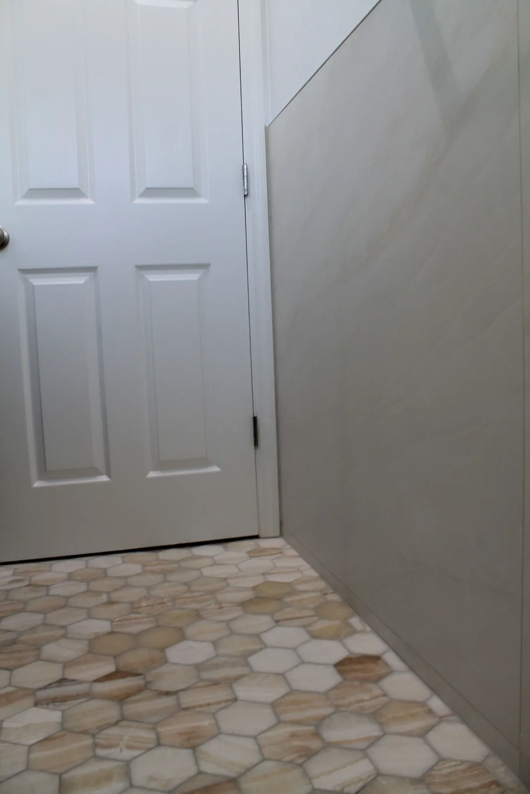 Honey onyx hexagon mosaic bathroom floor tile laid wall to wall